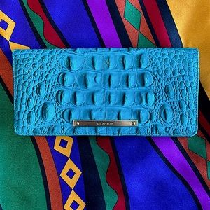 Brahmin ADY Wallet. Gently used. Three areas for bills & 12 credit card slots.